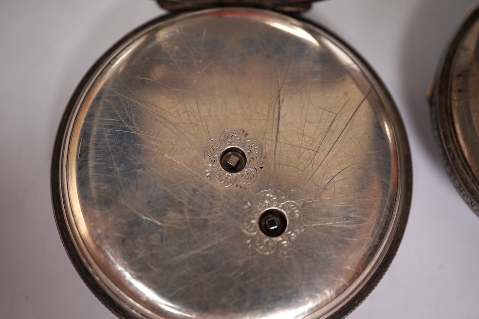 Three early to mid 20th century silver open faced pocket watches, with Roman or Arabic dials and subsidiary seconds, including two keyless and one key wind (Admiral Tacy Watch Co), together with one smaller silver open f